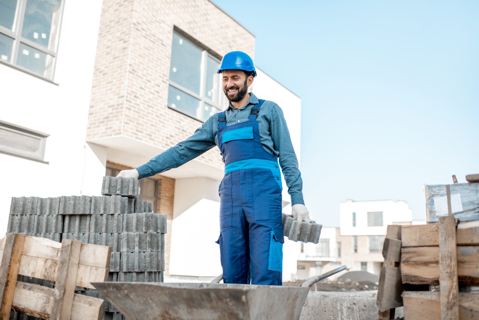 builder with paving blocks outdoors